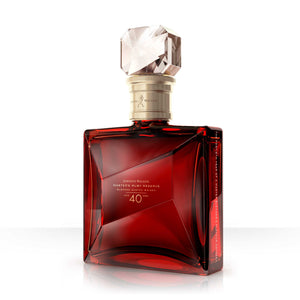 Three-quarter view of a bottle of Johnnie Walker Master's Ruby Reserve 40 Year Old whisky against white background