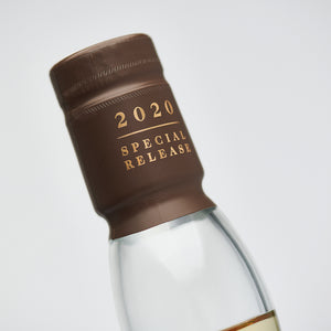 Close up of Lagavulin 12 Year Old - Special Release 2020 bottle cap seal against clean white background