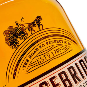 A close up of Carsebridge 48 Year Old Single Grain Scotch Whisky bottle against a white background