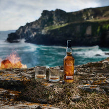 Load image into Gallery viewer, A bottle of Talisker Xpedition Oak 43 Year Old, with 2 glasses of whisky neat in the wild
