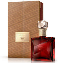Load image into Gallery viewer, Three-quarter view of a bottle of Johnnie Walker Master&#39;s Ruby Reserve 40 Year Old whisky with box against white background
