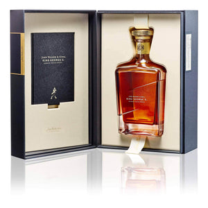A bottle of John Walker & Sons King George V, Blended Scotch Whisky in opened box against white background