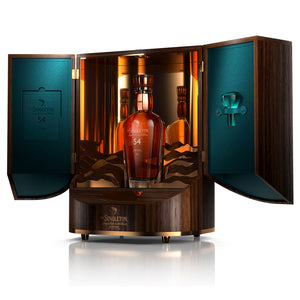 A bottle of The Singleton 54 Paragon of Time II, Single Malt Scotch Whisky in opened wooden cabinet, angled view