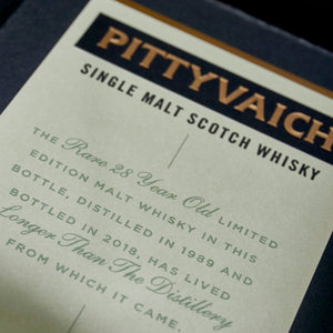 A close up of Pittyvaich 28 Year Old Single Malt Scotch Whisky box description against a white background