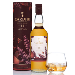 A bottle of Cardhu 14 Year Old Special Release 2019 with box and a glass of whisky on the rocks against white background