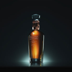 Three-quarter view of a bottle of The Singleton of Dufftown 53 Year Old, Single Malt Scotch Whisky in low lighting