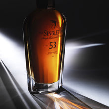 Load image into Gallery viewer, Cropped three-quarter view of a bottle of The Singleton of Dufftown 53 Year Old, Single Malt Scotch Whisky in low lighting
