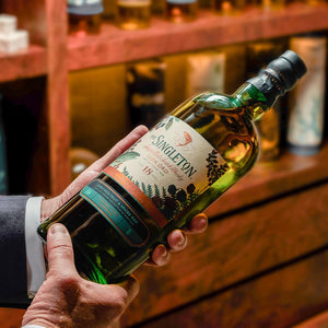 A hand holding a bottle of  The Singleton of Glen Ord 18 Year Old Special Release 2019  Single Malt Scotch Whisky