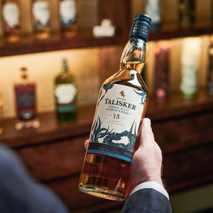 A bottle of Talisker 15 Year Old Special Release 2019, Single Malt Scotch Whisky held in hand